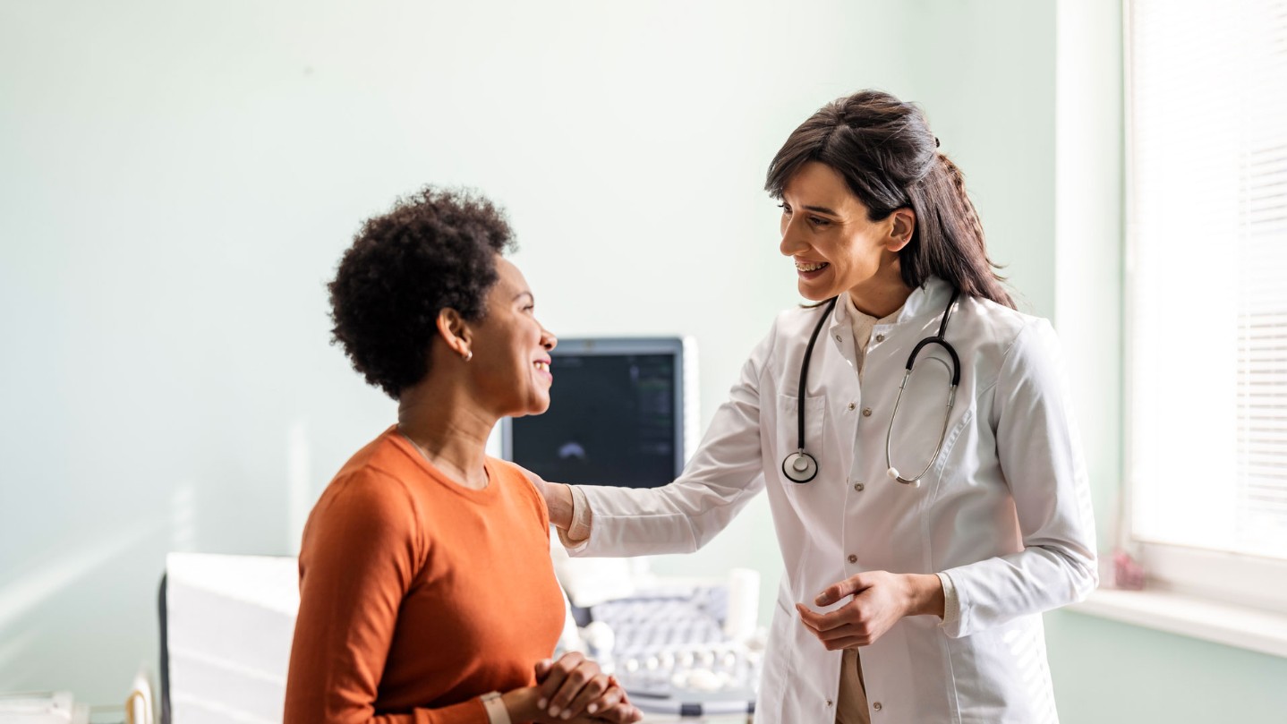 Female doctor and patient talking