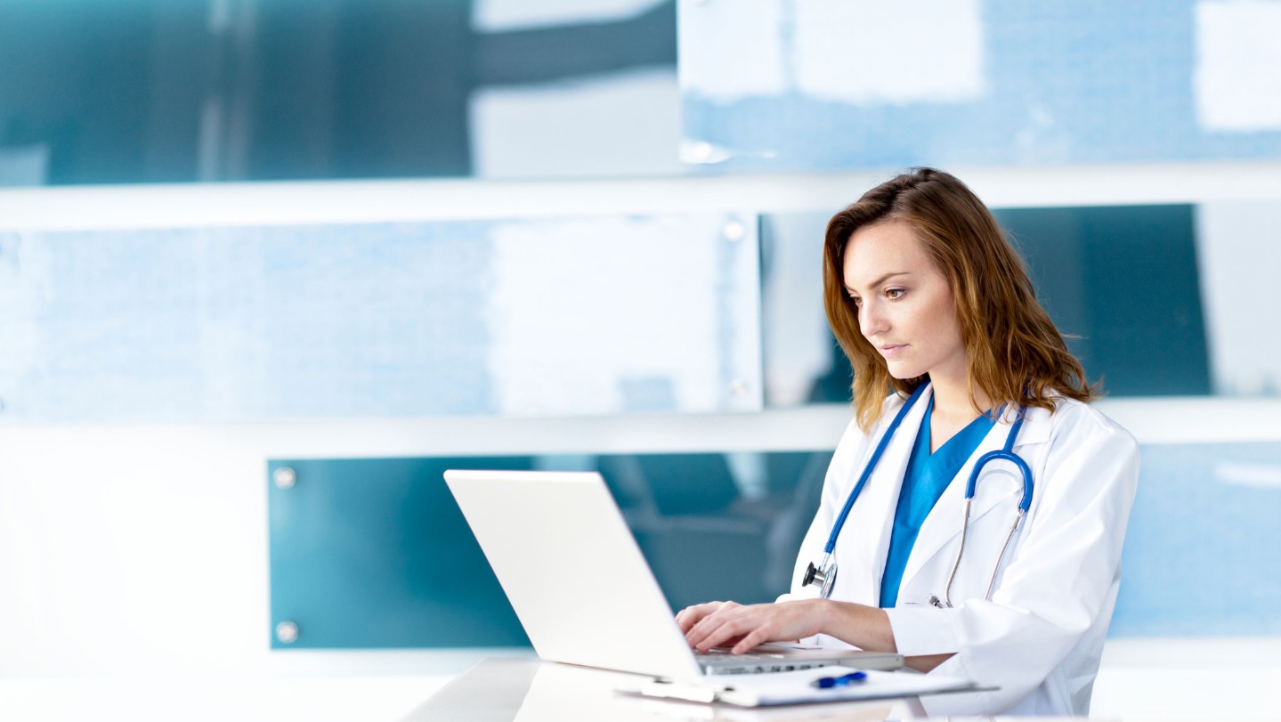 Female doctor on a computer